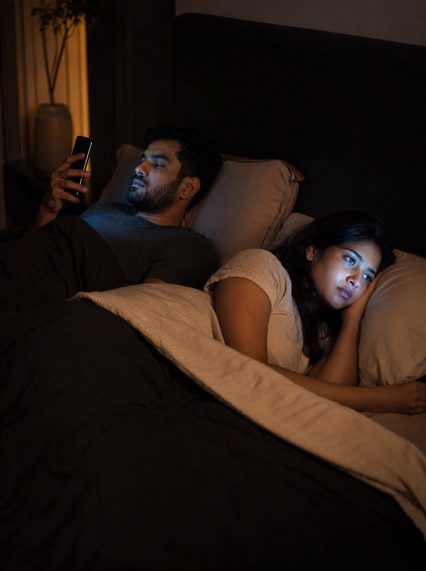 Awake partner bothered by phone light in a dark bedroom